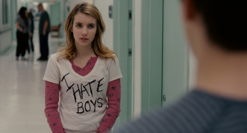 Emma Roberts stares disapprovingly at Keir Gilchrist while wearing an I Hate Boys t-shirt.